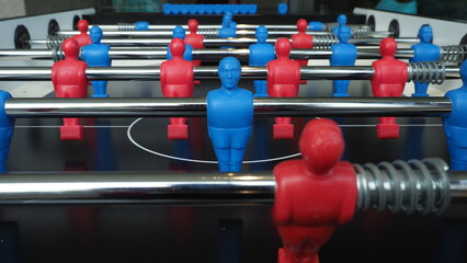 Football table or soccer table game with plastic player figurine. Mini Soccer game which famous in...