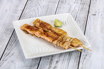 Grilled salmon skewer with sauce