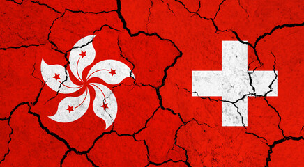 Flags of Hong Kong and Switzerland on cracked surface - politics, relationship concept