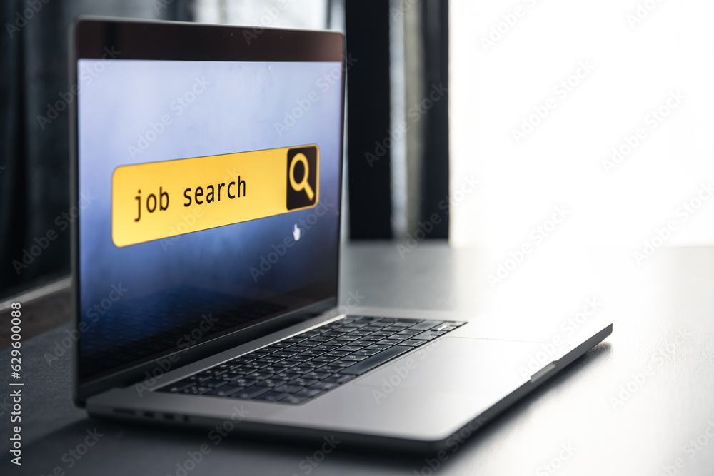 Sticker job search in computer application, website page on laptop screen.