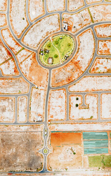 Aerial drone view of a construction site with roundabout streets, Flic en Flac, Black River, Mauritius.
