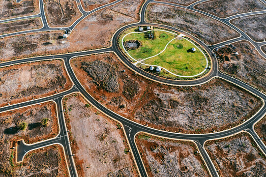 Aerial drone view of a construction site with roundabout streets, Flic en Flac, Black River, Mauritius.