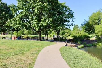 The empty pathway in the park on a sunny day.