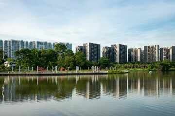 View of Jurong Lake with residential buildings on the shore. Singapore.