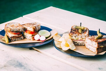 Freshly prepared sandwiches served on plates