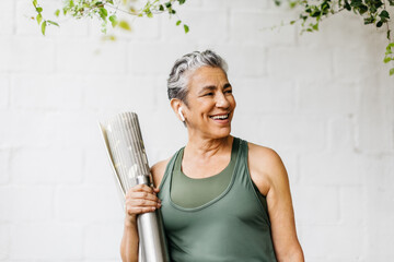 Taking an active approach to aging, happy senior woman engaging in a fitness routine outdoors