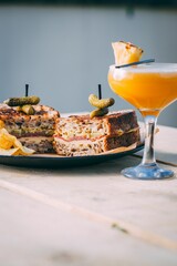 Refreshing drink and a freshly prepared sandwich on a table