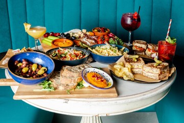 Assortment of delicious food and refreshing drinks on the table