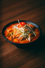 Bowl of traditional Malaysian onion cabbage soup, steaming hot and ready to be enjoyed