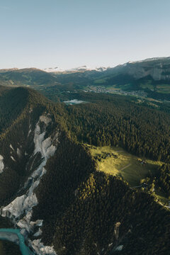 Aerial drone view of a plateau on the ridge of Rheinschlucht at sunrise, Flims, Graubunden, Switzerland.