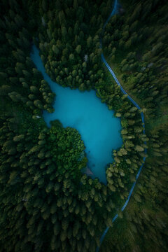 Aerial drone view a blue water lake, Lag Prau Tuleritg, Flims, Graubunden, Switzerland.