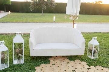 wedding ceremony set up in garden setting with seating area next to lawn