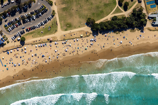 Aerial view of people on the beach at Lorne Queens-cliff Coastal reserve, Lorne, Victoria, Australia.