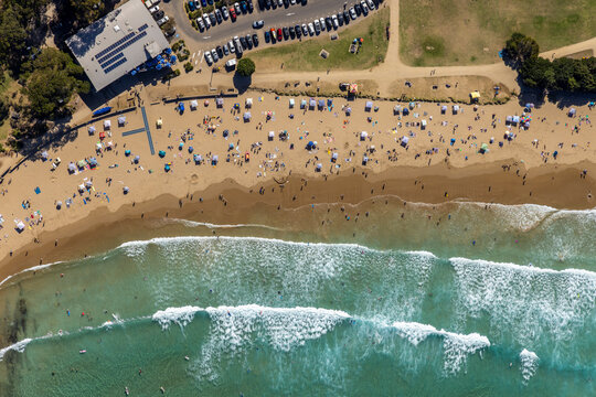 Aerial view of people on the beach at Lorne Queens-cliff Coastal reserve, Lorne, Victoria, Australia.