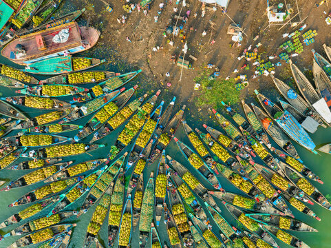 Aerial view of floating market of seasonal fruits on the boats in Kaptai Lake, Rangamati, Bangladesh.