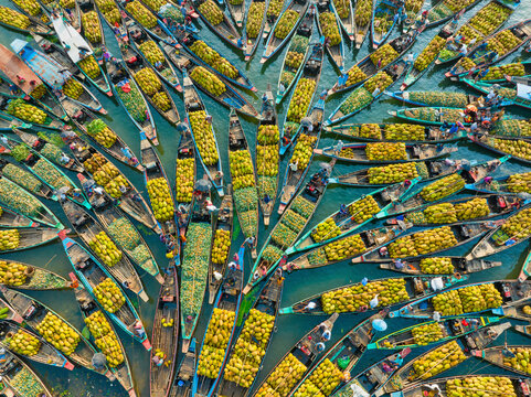 Aerial view of floating market of seasonal fruits on the boats in Kaptai Lake, Rangamati, Bangladesh.