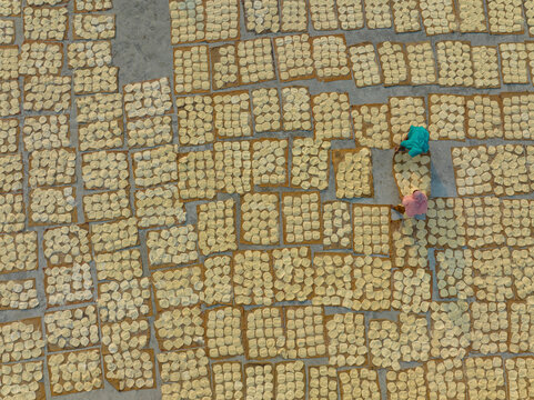 Aerial view of people working in the traditional vermicelli factory in Bogura, Bangladesh.