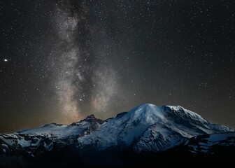 Fototapeta na wymiar View of the night sky over Mount Rainier, featuring a bright Milky Way
