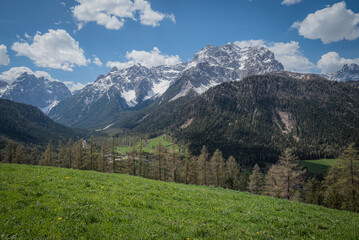 landscape of beautiful mountains in the alps cloudy day with blue sky