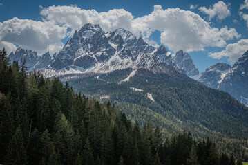 landscape of beautiful mountains in the alps cloudy day with blue sky
