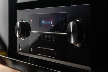Fototapeta na wymiar Modern, black audio video receiver with a glossy finish and minimalistic design