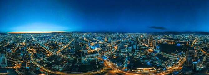 Fototapeta na wymiar Panoramic view of a bustling cityscape illuminated at night