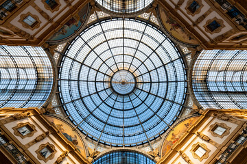 Glass roof in historic public gallery passage in Milan, Italy. Symmetric vertical view from the...
