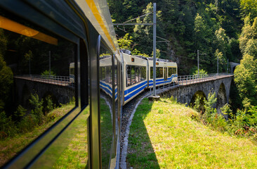 View out of a coach of the Centovalli railway, a popular electric narrow gauge train between...