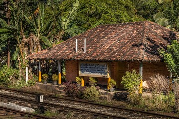 a picture of a small train station on a train track