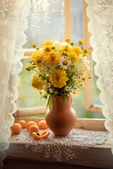 Still-life. Photo of a bouquet of flowers on the window.