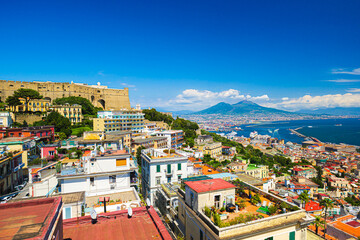 Naples, Italy. View of the city from above, with the Gulf of Naples and Mount Vesuvius. On the left the Hill of San Martino with Castel Sant'Elmo. 2023-07-04.