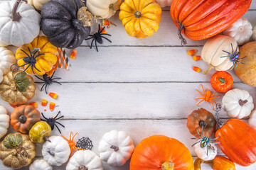 Thanksgiving, Halloween fall autumn season holiday background with colorful pumpkins. Stack of...