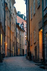 Fototapeta na wymiar Picturesque cobblestone street with old town buildings. Gamla stan, Stockholm, Sweden.