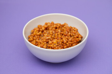 Fototapeta na wymiar Boiled lentils in white bowl - Vegetarian food