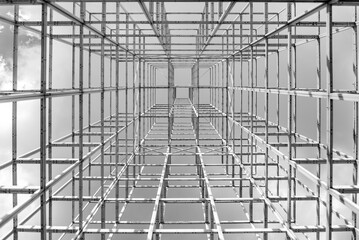 Black and white tone, low angle diminishing perspective view inside wireframe cubic 3d grid...