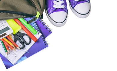 School supplies and a student backpack isolated, transparent background, top view. PNG	