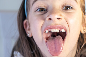 Child during orthodontist visit and oral cavity check-up.