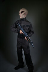 Fototapeta na wymiar Male Alien Soldier Standing with Gun 