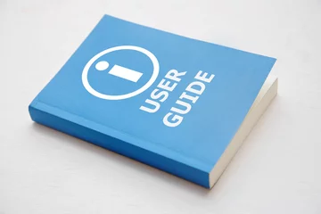 Foto op Plexiglas User guide book, Blue cover book on white background, instruction manual for user training  © wor_woot