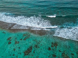 Aerial of the Caribbean sea with roaring waves