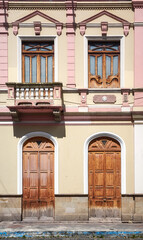 Street view of an old building facade, architecture background, Riobamba, Ecuador.