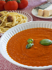 Marinara Sauce with Pasta and Meatballs, and Parmesan Cheese Wedge in Background 