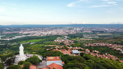 Visual aéreo da estátua religiosa do Padre Cícero no interior da cidade de Juazeiro do Norte no estado do Ceará captada do alto por um drone. 