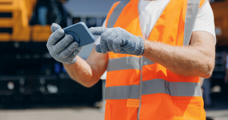 Banner Modern technology of Industry. Builder operator use mobile tablet online control o excavator...