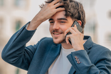 urban young man on the street talking on mobile phone