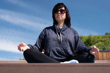concept of an active lifestyle. A close-up portrait of a mature Caucasian woman in a sports outfit,...