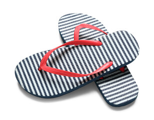 Pair of striped flip-flops on white background