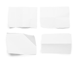 Pieces of creased paper sheets isolated on white background