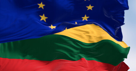 The flags of Lithuania and the European Union waving together on a clear day
