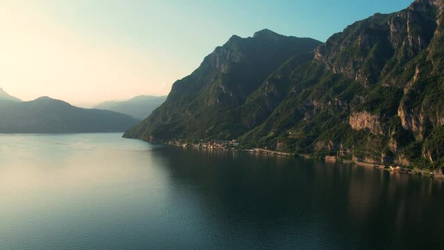 Aerial 4K footage of a flight over a lake Iseo during a sunset, Lombardy, Italy